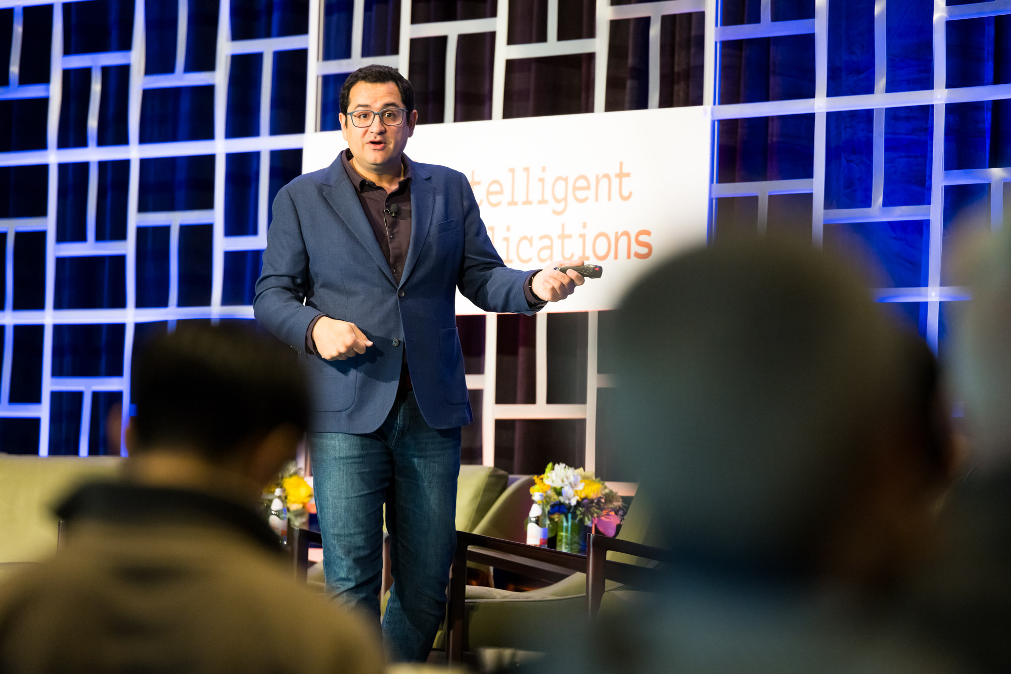 Ali Farhadi speaks onstage about open-source AI models at the 2023 Intelligent Applications Summit.